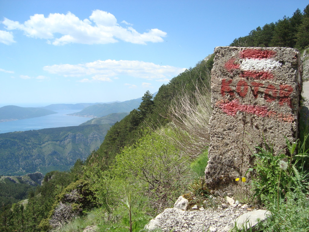 Half way! The sign pointing back over the bay towards Kotor.