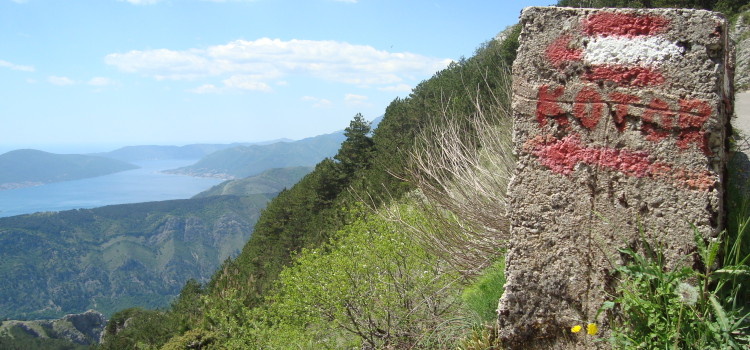 Half way! The sign pointing back over the bay towards Kotor.