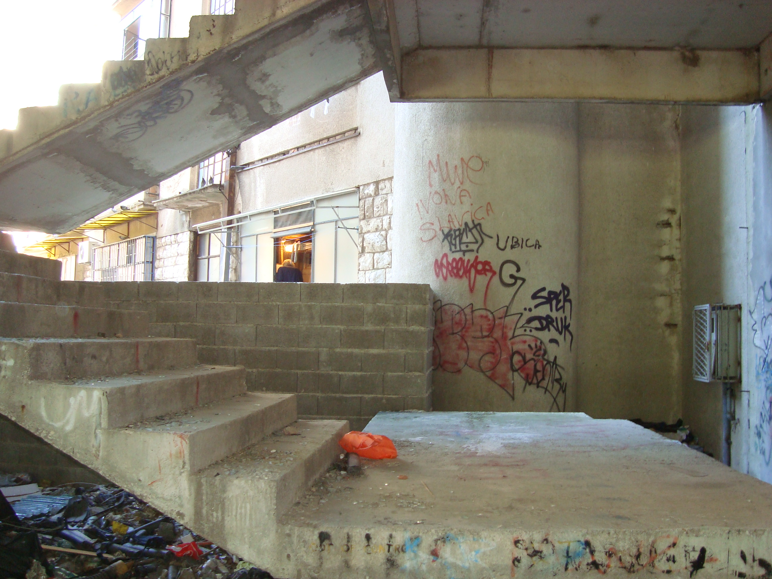 Man painting, apartment block next to the sniper's nest